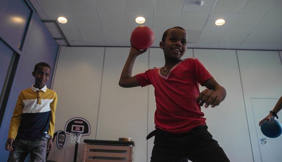Playing dodgeball during TeamUp at School children who grew up in war learn to work together in a team and deal with frustration in a healthy way_War Child_2010XX.